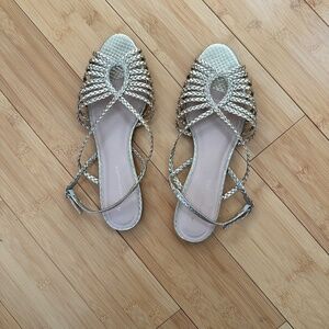 Flat gold woven sandals